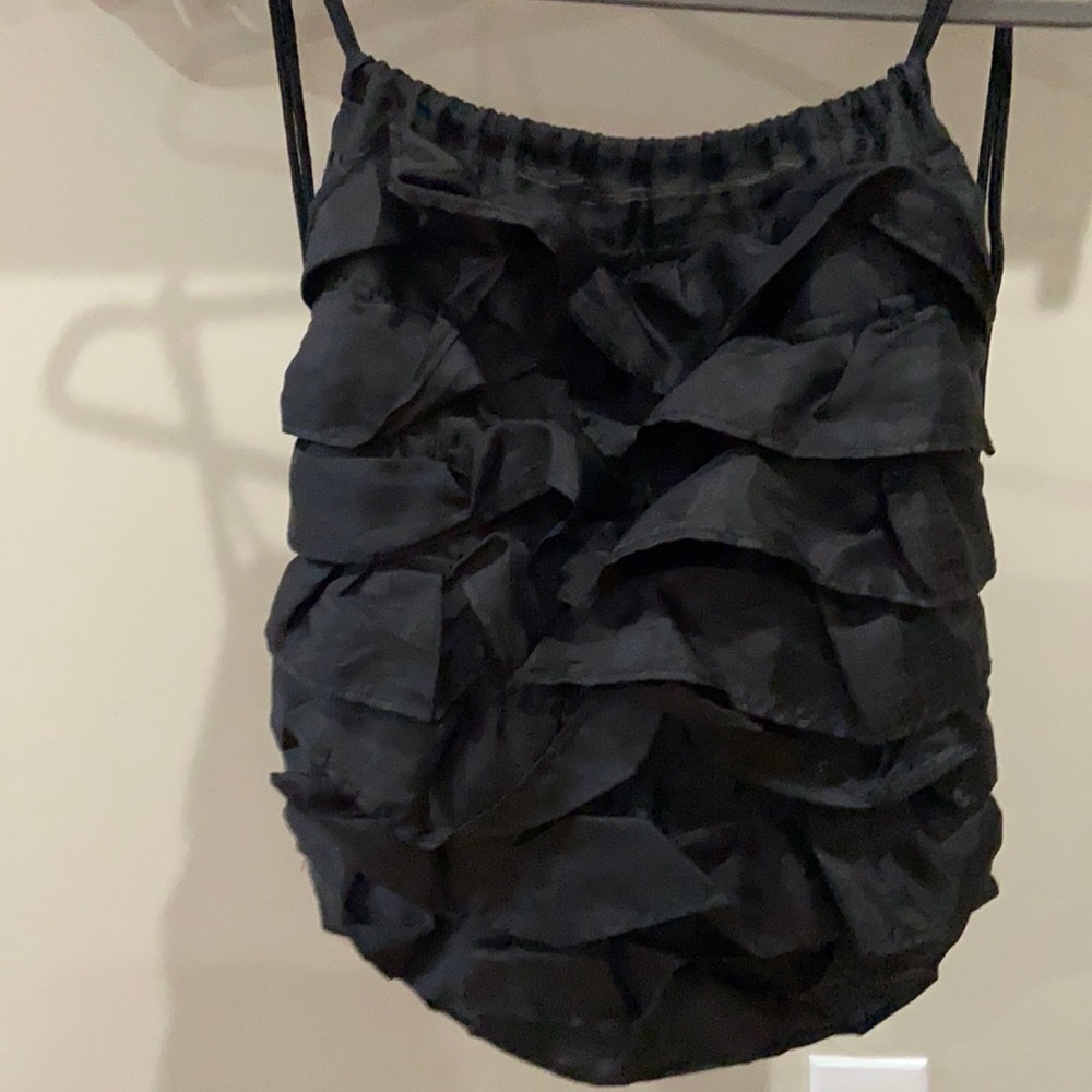 Backpack ruffle light weight! Super cute ! Zip pocket on the back outside!